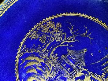 Four Chinese gilt-decorated blue-ground cups and saucers with fine landscapes, Qianlong